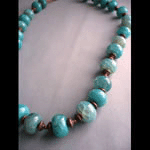 Aqua colored fired agate necklace with copper beads